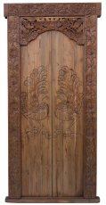 ornately carved teak door